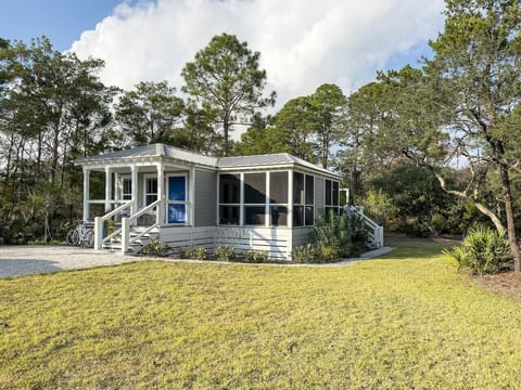 The home is situated on a large lot with a grassy area to play.