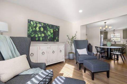 Equipped with a 65" smart tv, plenty of seating, lots of light, & board games.