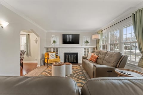 Cozy living room with lazyboy sofas and fireplace + TV