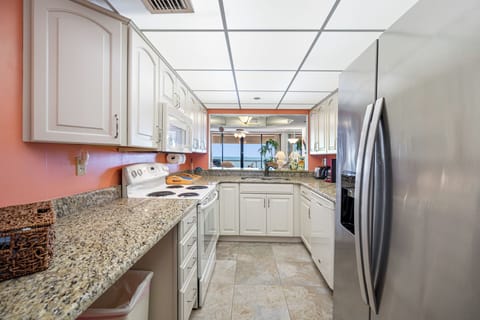 Fully equipped kitchen with modern appliances and ample counter space.