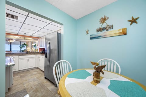 Charming breakfast area with coastal decor and plenty of natural light.