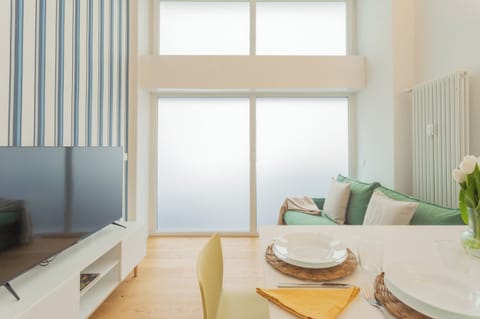 Apartment (1 Bedroom) | Living area | 32-inch Smart TV with cable channels