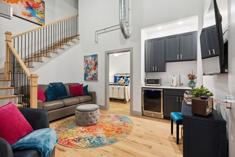 Welcome to Majestic Lofts 602! First floor - den, kitchenette and bedroom #1