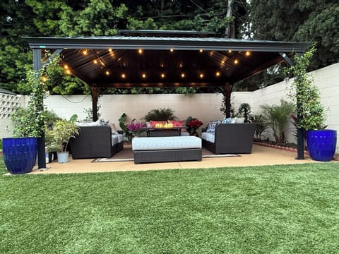 Outdoor gazebo with firepit and lights. This is shared with other units 