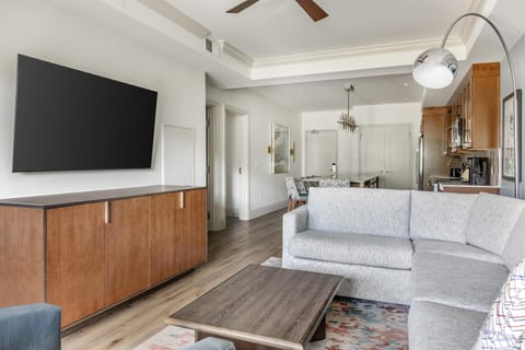 65-inch flat-screen TV with cable channels, fireplace