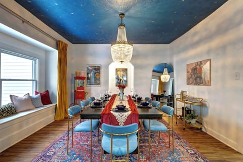 Elegant dining area, featuring a beautifully set table with six seats