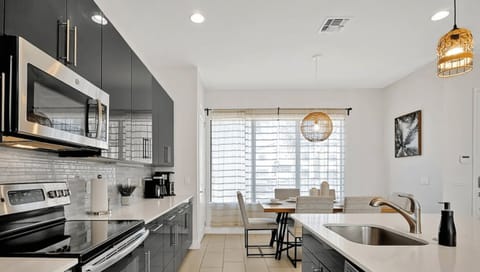 A beautifully designed kitchen with sleek finishes and all the essentials, perfect for preparing delicious meals.