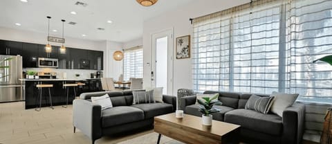 The open floor plan creates a spacious and inviting atmosphere, perfect for both relaxation and entertaining.