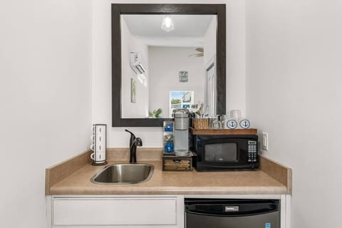 Kitchenette with mini fridge, microwave and coffee maker