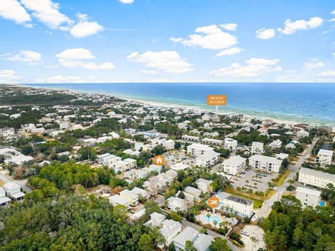Drone photos of the proximity to the beach access and neighborhood pool.
