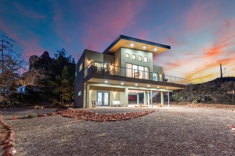 Secluded and private entrance (lower unit) with cozy front patio and dedicated covered parking.