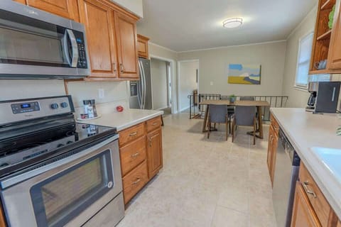 Kitchen with stainless steel appliances and wooden cabinets