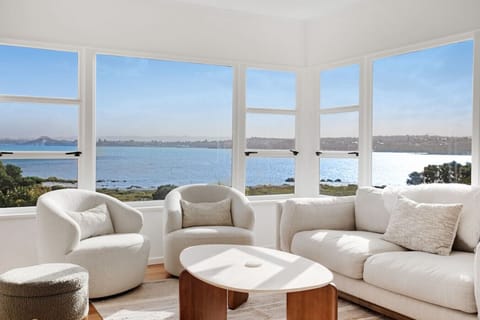 Relax in the living room and enjoy the beautiful view of the bay.