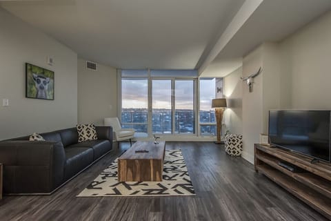 Kick back, relax, and watch the sunset right from the couch. Modern comfort meets sweeping city views.