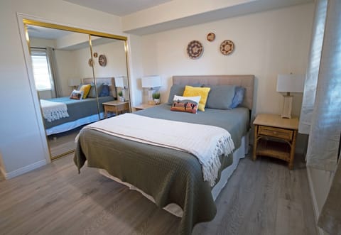 Retreat to the Master Suite featuring a plush King-size bed.