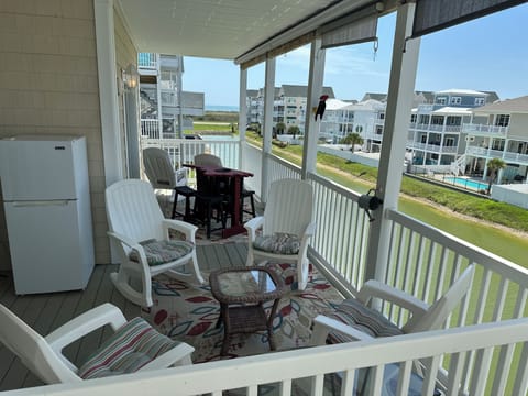 Your vacation coffee spot—spacious covered balcony with pond and ocean views.