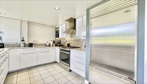 Spacious, well-equipped kitchen with Sub-Zero fridge.