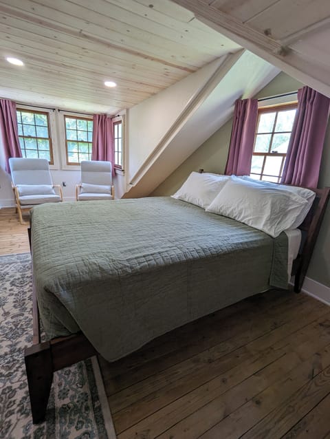 Attic bedroom and reading area located in the rear double dormer.