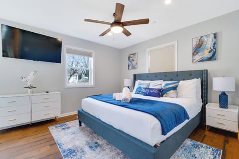 Indulge in the comfort of this master suite w/ a king bed, TV & luxurious linens