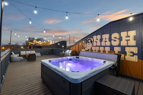 Relax under the stars in your private hot tub with stunning Nashville skyline views. This chic rooftop retreat is ideal for bachelorette parties or family reunions. Gather your friends, unwind, and make unforgettable memories in Music City.