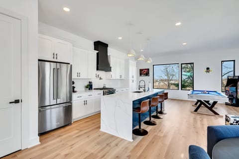 Experience this chic vacation rental that blends modern elegance with fun! Ideal for large groups or family reunions, it features a stylish kitchen and game room, all just minutes from vibrant Downtown Nashville. Your luxurious getaway awaits!