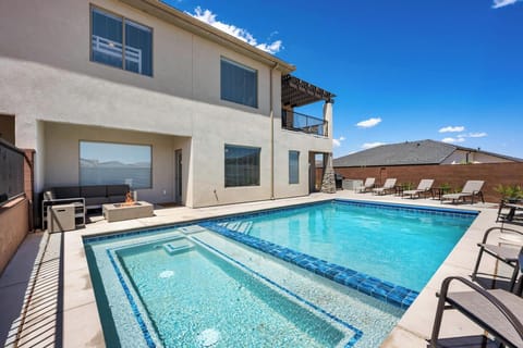 Unwind in your private heated pool & hot tub with lounges eating & fire pit