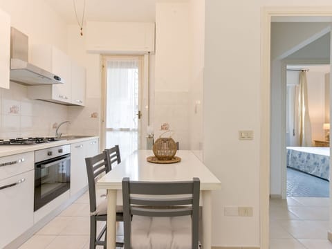 Interior Design, Furniture, Flooring, Wood, Floor, Ceiling, Room, Lighting, Kitchen & Dining Room Table, Apartment