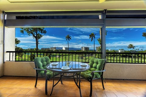 Relax and unwind on the lanai with stunning golf course and ocean views!