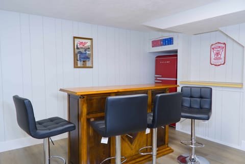 Basement Pool Room with 75in TV, Fridge, and Bar