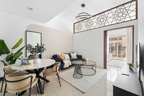 Signature Apartment, Multiple Beds | Living area | 50-inch Smart TV with digital channels