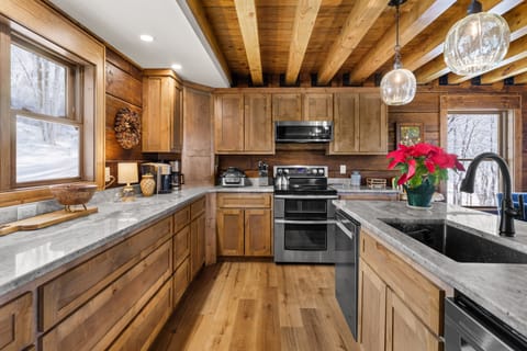 Spacious Kitchen with Granite Counters and Stainless Appliances