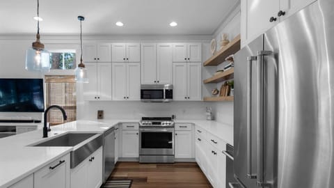 Kitchen: Drip coffee maker, Keurig, blender, toaster oven, waffle maker, cooking utensils, tableware