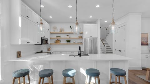 Kitchen: Drip coffee maker, Keurig, blender, toaster oven, waffle maker, cooking utensils, tableware