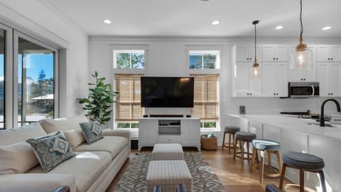 Living room: Smart TV, central heat, central A/C, main floor, screened-in porch access