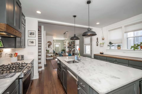 The elegant, open kitchen offers ample space & all the comforts of home