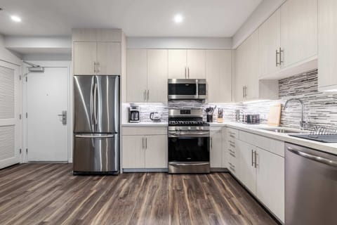 Full panoramic view of the kitchen — sophisticated, functional, and inviting, with a balance of form and practicality.