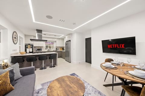 Step into the heart of luxury, where elegance meets comfort. This living room is designed to impress, featuring high ceilings, statement lighting, and plush seating that invites relaxation.