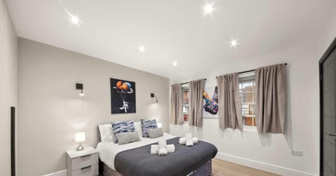 A peaceful bedroom designed for rest and relaxation, with soft bedding and a calm atmosphere that invites you to unwind after a long day.