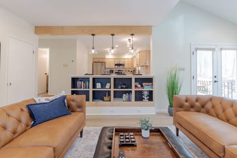 Great flow from the family room to the kitchen, connected by an island bar