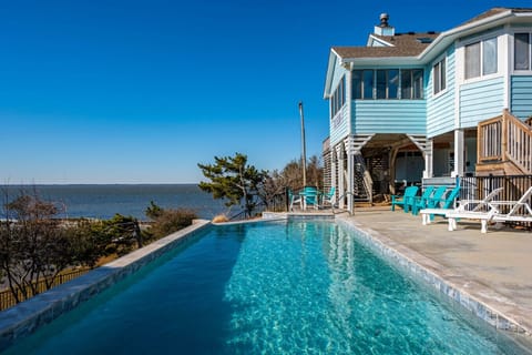 Oceanfront pool w/ sweeping water views, perfect for cooling off while soaking in the coastal scenery.
