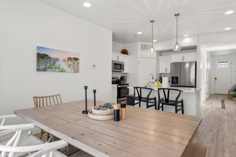 Dining table in open kitchen and living area