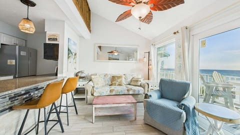 Living area with sofa bed TV and balcony access