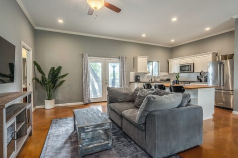 Stylish open-concept living with modern kitchen and cozy lounge area.