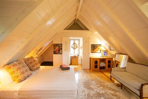 Master bedroom second floor leading to shower, small nook for child to sleep.