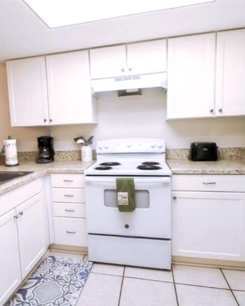 Full Kitchen with stacked washer dryer inside closet