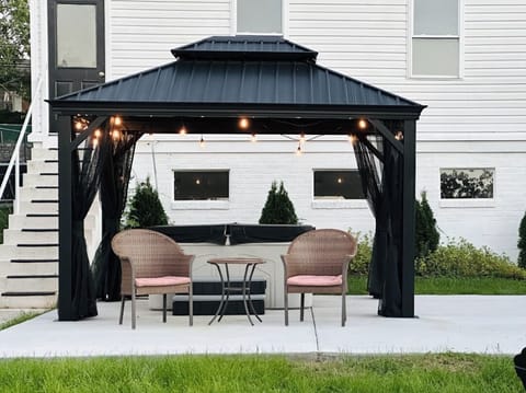 Backyard, pergola with outdoor seating & hot tub
