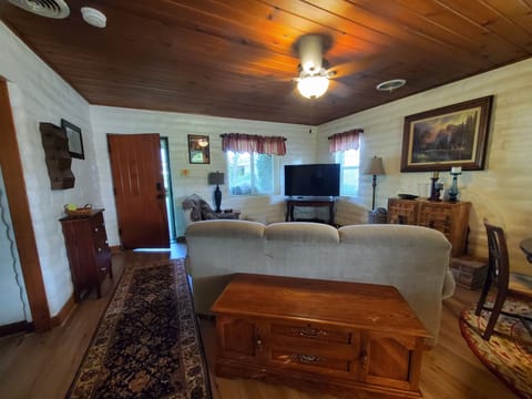 Living room view from built-in desk/dining area