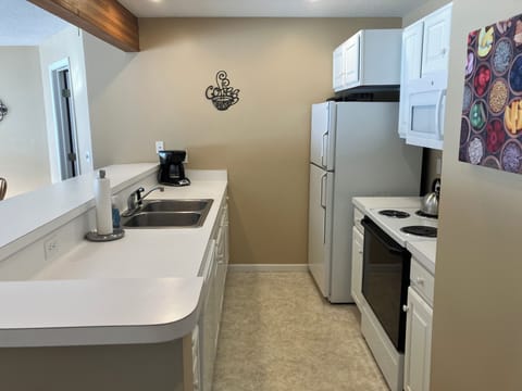 Full kitchen stocked with necessities 