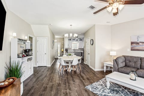 Open concept living with vinyl plank flooring throughout
