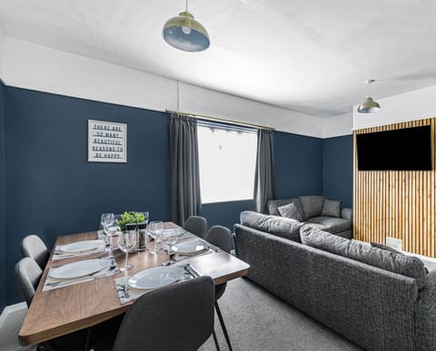 Lounge dining area. One sofa can be converted into a sofa bed.